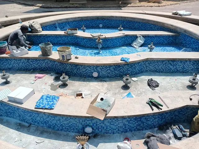 Mosaic works and equipment fitting inside the basin
