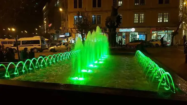 Linear fountain in a green lighting scene