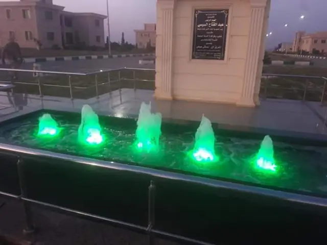 The same fountain in a green lighting scene