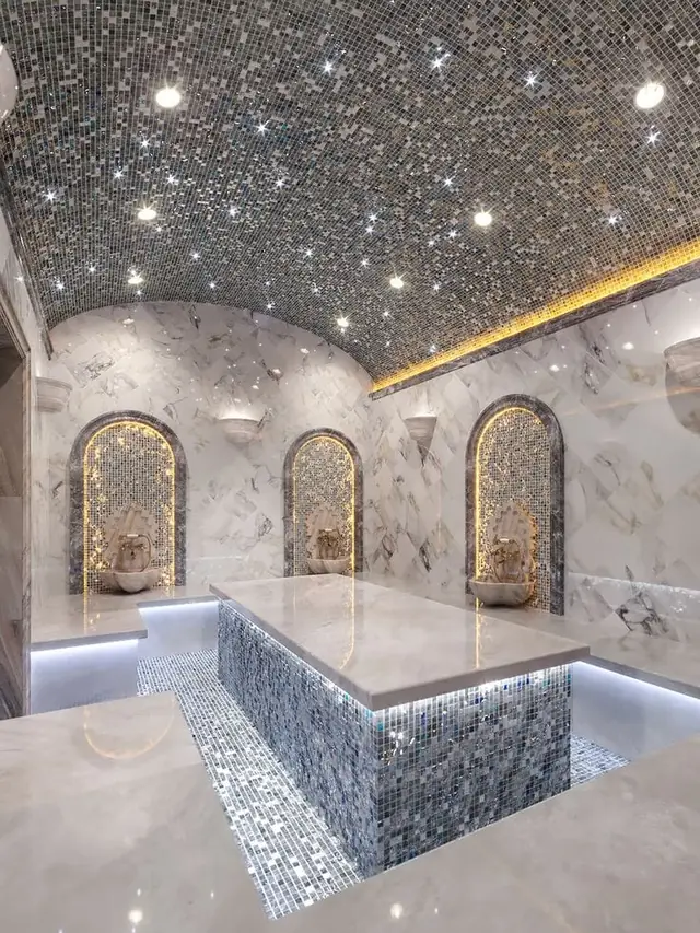 Marble hammam with mosaic platform and starlit ceiling