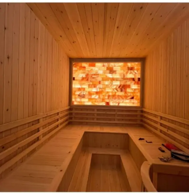 Salt room with Himalayan wall and timber benches